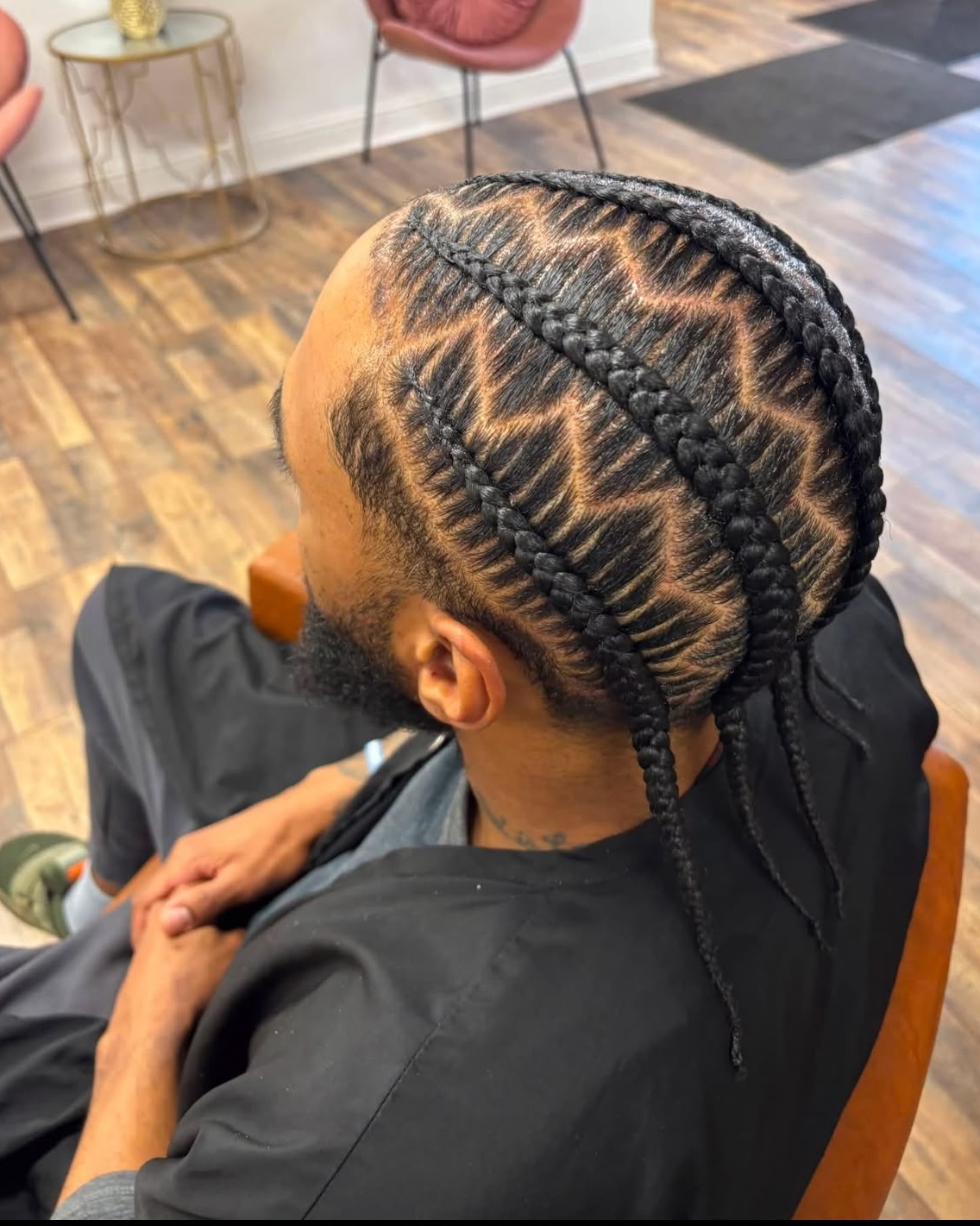 Zigzag stitch cornrows with sharp clean parting on a male client at Stella Braids and Hair Studio in Covina
