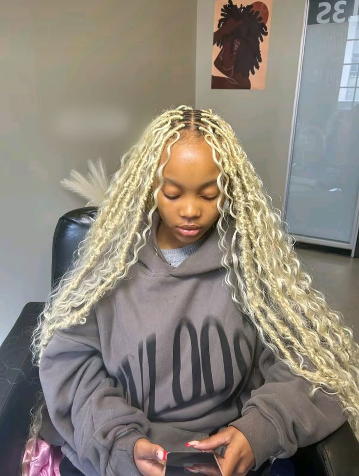Long blonde goddess locs styled at Stella Braids and Hair Studio in Covina